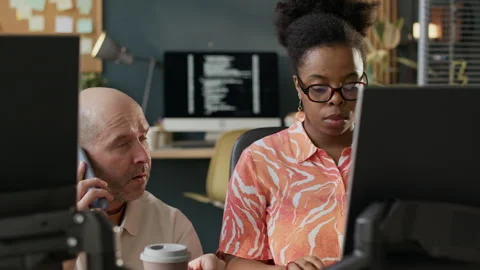 Diverse Programmers Discussing Work during Teaching Process 스톡 동영상 306843916