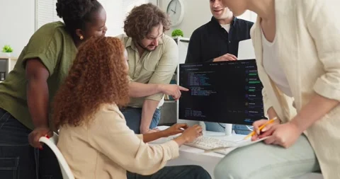 Diverse programmers team discussing code at computer in modern office 스톡 동영상 337560671