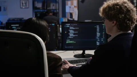 Diverse Programmers Working on Cybersecurity Code in Office Stock Footage 347296934