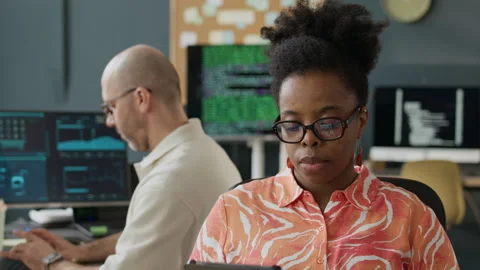 Diverse Programmers Working in Modern Open Space Office Stock Footage 306847950