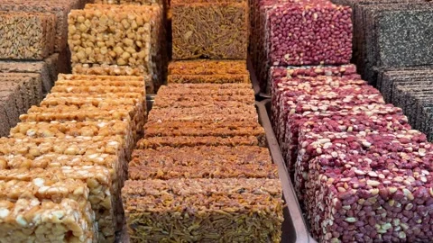 Diverse Rows of Traditional Chinese Nut and Peanut Brittle Cakes Stock Footage 334699081