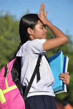 Diverse School Girl Memory Problems Wearing Bookbag With School Books 스톡 사진