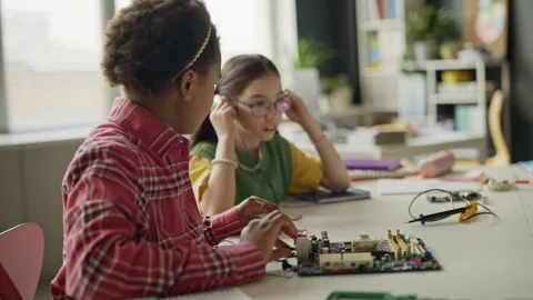 Diverse Schoolgirls Assembling Computer Motherboard in Stem Class Stock Footage 340548992