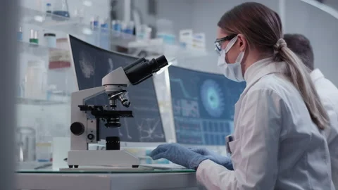Diverse scientists studying brainwave scanning and human skeleton Video stock 149801223