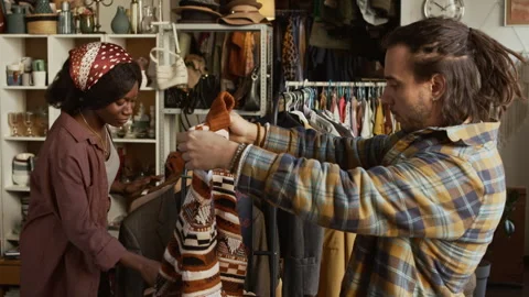 Diverse Second Hand Employees Working Together Hanging Clothes Stock Footage 327812243