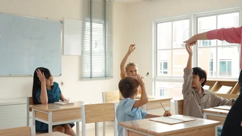 Diverse smart student raised hands to answer question at classroom. Pedagogy. Stock Footage 274930417
