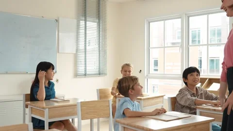 Diverse smart student raised hands to answer question at classroom. Pedagogy. Stock Footage 283403906