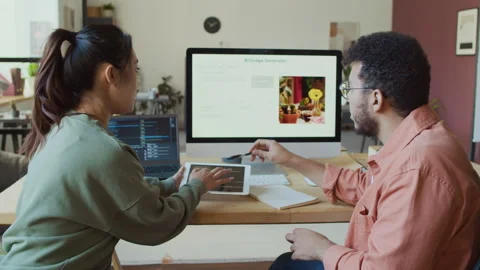 Diverse Software Developers Arguing over Computer Code in Office Stock Footage 293120225