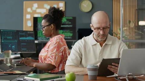 Diverse Software Engineers Developing Program Code in Open Space Office Stock Footage 306840313