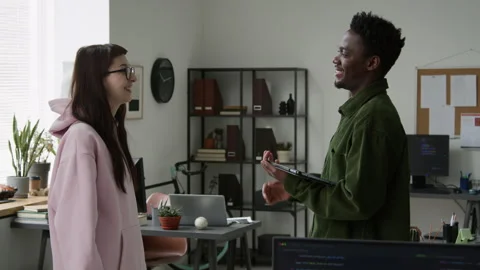Diverse Software Engineers Discussing Project Work Plan and Giving High Fives Stock Footage 335937481
