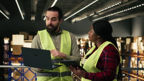 Diverse staff members, logistics operations, warehouse platform Stock Footage 330207192