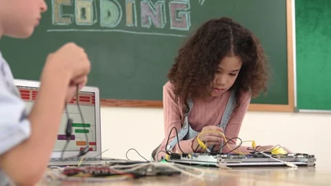 Diverse student working electronic board while laptop display prompt. Pedagogy. Stock Footage 268964481