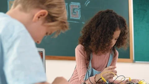 Diverse student working electronic board while laptop display prompt. Pedagogy. Stock Footage 275634086