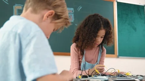 Diverse student working electronic board while laptop display prompt. Pedagogy. Stock Footage 283804872