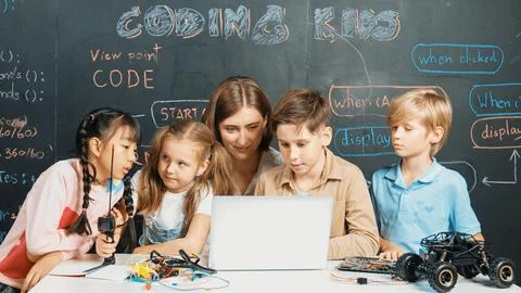 Diverse student writing engineering code while boy fixing board. Erudition. 스톡 사진