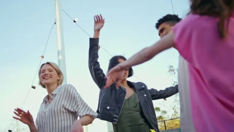 Diverse students dancing together at rooftop party closeup. Carefree youngsters Stock Footage 252001135