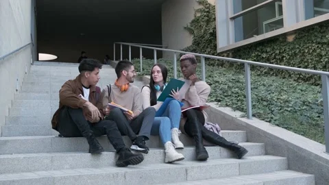 Diverse students doing homework on steps Stock Footage 231625099