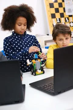 Diverse students in programming school learning to code 库存照片