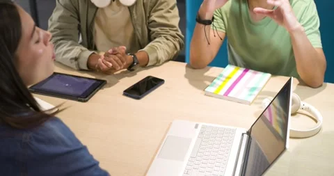 Diverse students starting work at study hub after headphones man leaning Stock Footage 336784338