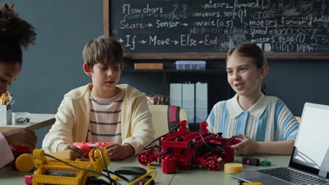 Diverse Students with Teacher Building Robots in Robotics Lesson Stock Footage 339189988