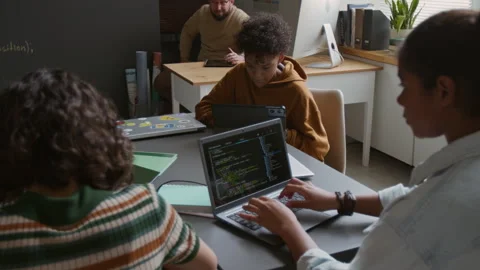 Diverse Students Working on Coding Tasks during IT Class Stock Footage 318717849