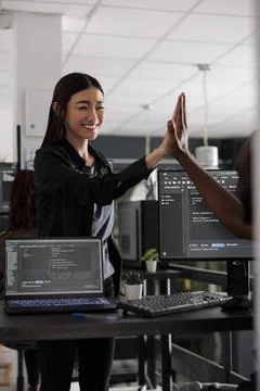 Diverse successful web developers celebrating code compiling 스톡 사진