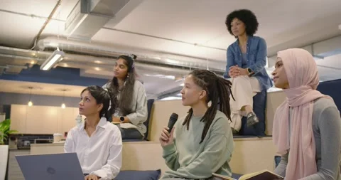Diverse team applauding in office after slide ending, laptop user clapping as Stock Footage 343439816