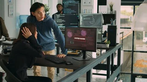 Diverse team of artificial intelligence cloud programers being hacked 写真素材