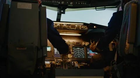 Diverse team of aviators throttling engine lever to takeoff Stock Footage 199570986