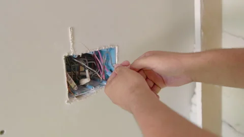 A Diverse Team of Builders Collaborating on House Renovation Projects Bringing Stock Footage 306042843