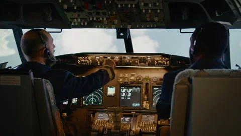 Diverse team of captain and copilot using dashboard command Stock Footage 199573323