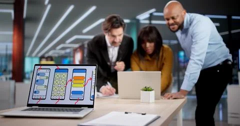 Diverse Team Collaborates On App Design, Developing User-friendly Interfaces. Stock Photos