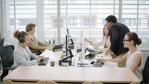 Diverse team collaborating effectively in office meeting, enhancing productivity Stock Footage 281123437