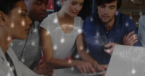 Diverse team collaborating on laptop with binary code animation overlay Stock Footage 304011403