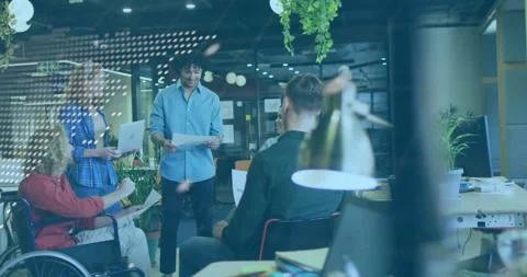 Diverse team collaborating in modern office with software code overlay animation Stock Footage 303942287