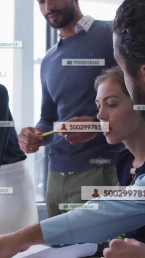 Diverse team collaborating at office with data processing animation overlay Stock Footage 344370335