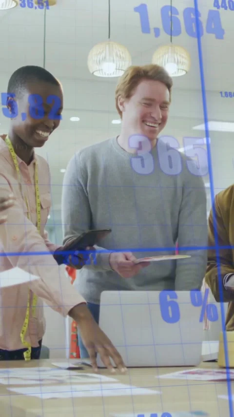 Diverse team collaborating at office with financial data animation overlay Stock Footage 344404133