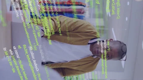 Diverse team collaborating in office with green coding animation overlay Stock Footage 314144097
