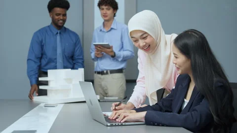 Diverse Team Collaborating on Office Project Stock Footage 286073275