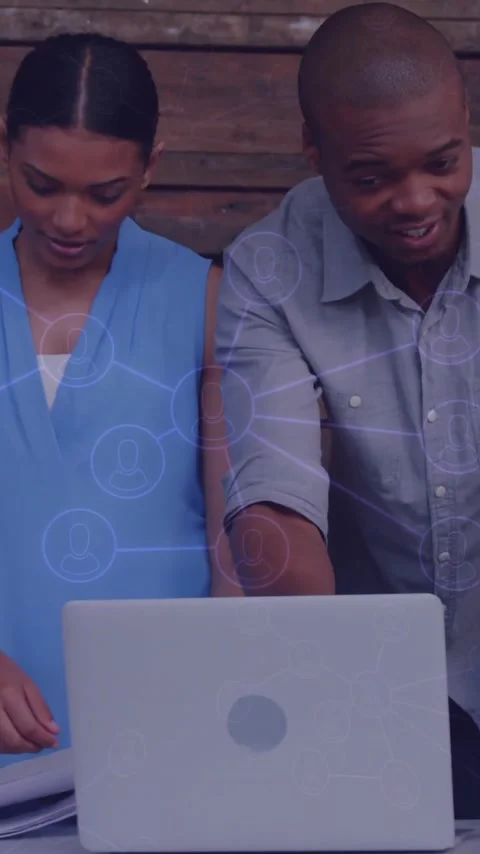 Diverse team collaborating over laptop with network connections animation Stock Footage 344404077