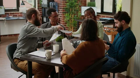 Diverse team of colleagues working on business collaboration Stock Footage 211891211