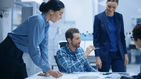 Diverse Team of Computer Engineers, Specialists Gather Around Conference Table Stock Footage 124855537