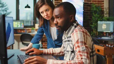 Diverse team of developers working on infographics development Stock Photos