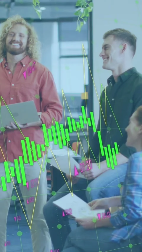 Diverse team discusses documents and statistical data in an office setting. Stock Footage 344775060