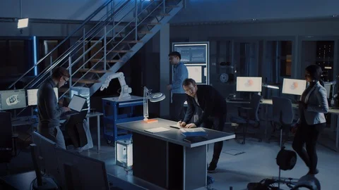 Diverse Team of Electronics Development Engineers Gather at the Desk Working Stock Footage 104660518