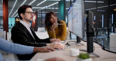 Diverse Team Of Employees Using CRM Software For Business Training And Strate Stock Photos