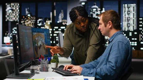 Diverse team of engineers using artificial intelligence to design a floor plan Stock Photos