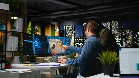 Diverse team of engineers using artificial intelligence to design a floor plan 스톡 사진