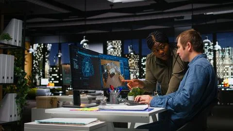 Diverse team of engineers using artificial intelligence to design a floor plan Stock Photos