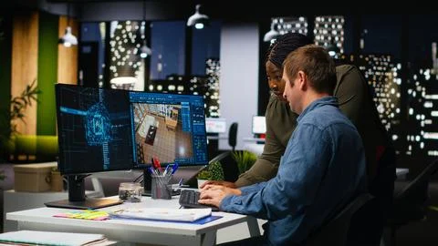Diverse team of engineers using artificial intelligence to design a floor plan Stock Photos